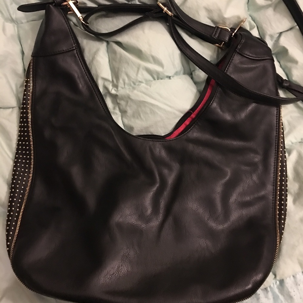 Large black handbag with crossbody strap